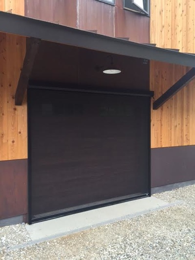 retractable screen over a garage door