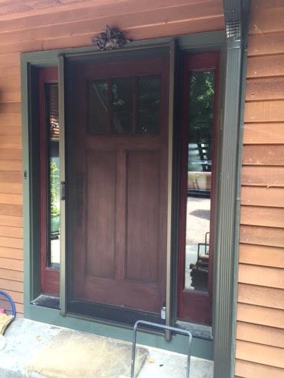 retractable screen on a wooden front door
